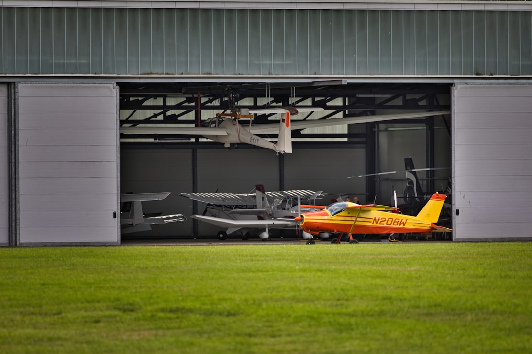 Aircraft hangar with multiple planes parked in a maintenance area where FOD cans are commonly placed